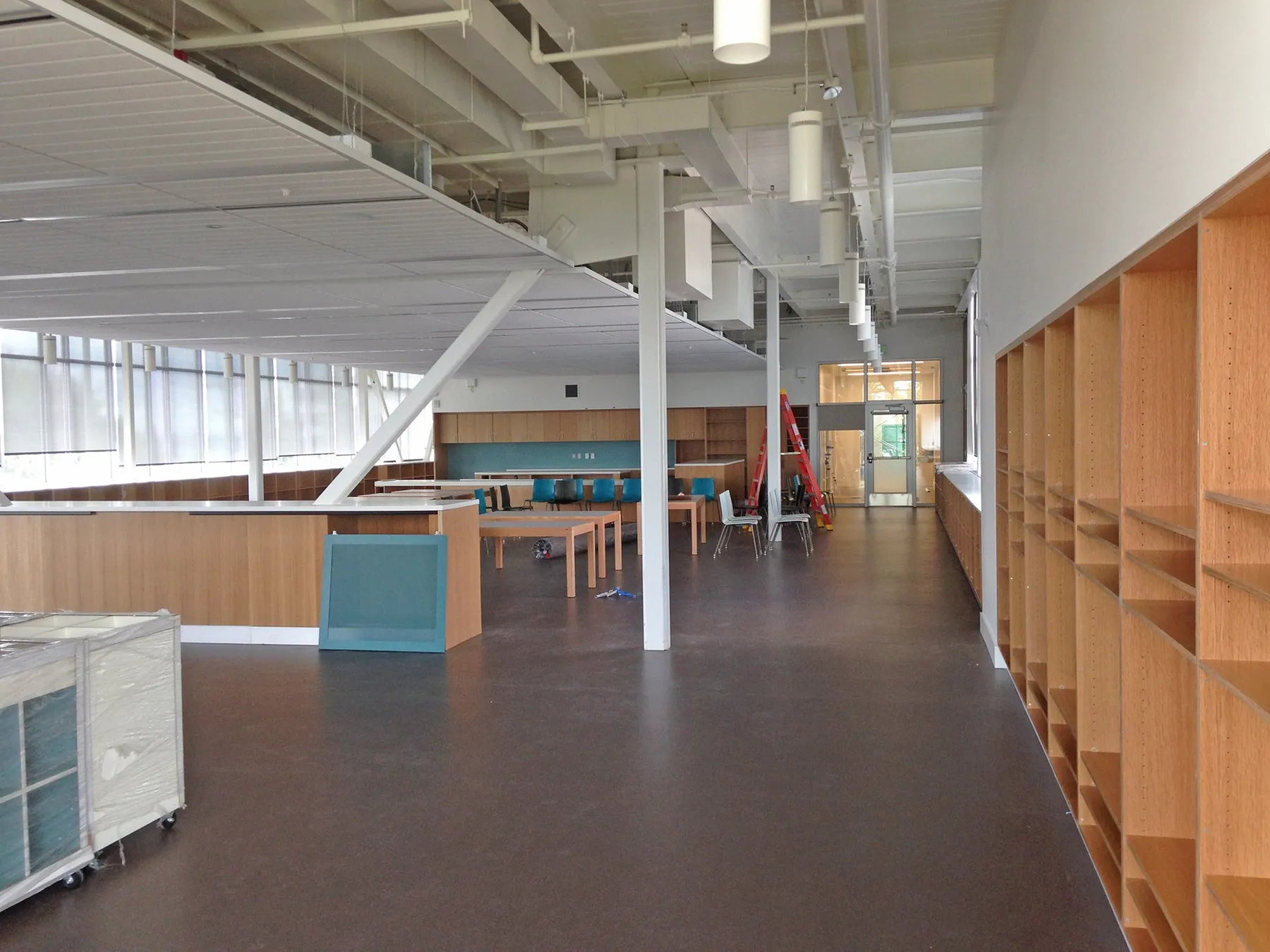 Bright open corridor with wood cubbies inside the renovated Magnolia school