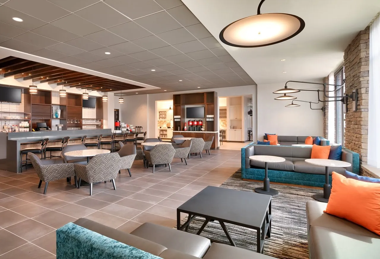 Hyatt Place lobby lounge and dining area with modern seating